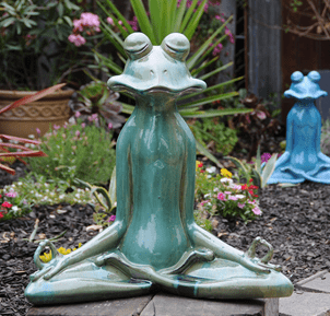 green meditating frog